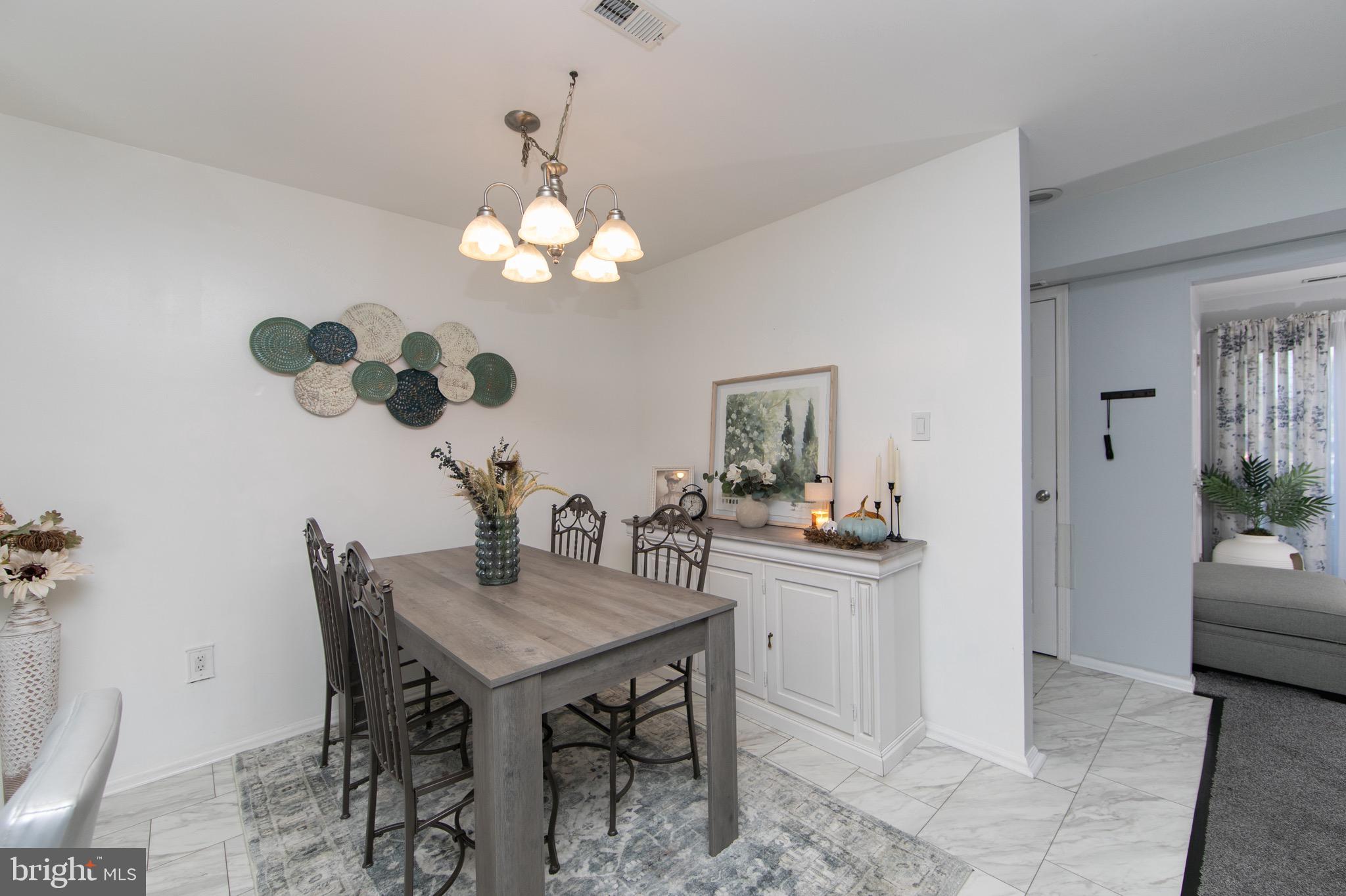123 Birchfield Court Mount Laurel, NJ 08054 - Photo 7 of 32 a view of a dining room with furniture and chandelier