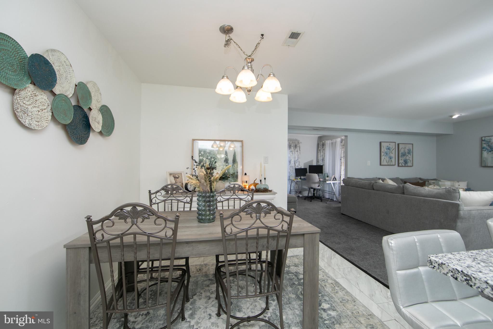 123 Birchfield Court Mount Laurel, NJ 08054 - Photo 9 of 32 a view of a dining room with furniture and chandelier