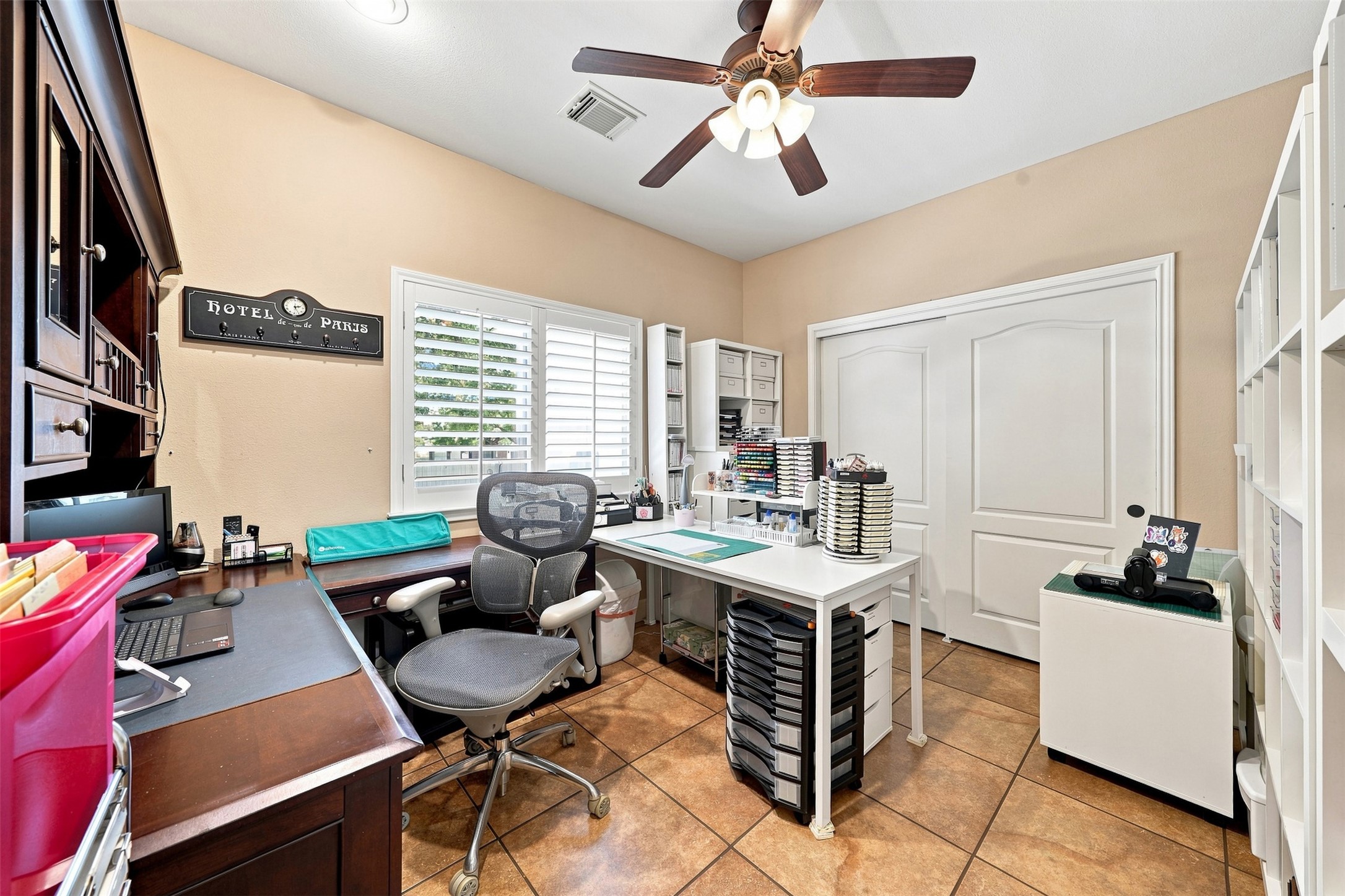 402 Ridgetop Bend Cedar Park, TX 78613 - Photo 31 of 40 Durable tile flooring and dual closets enhance this functional home workspace.