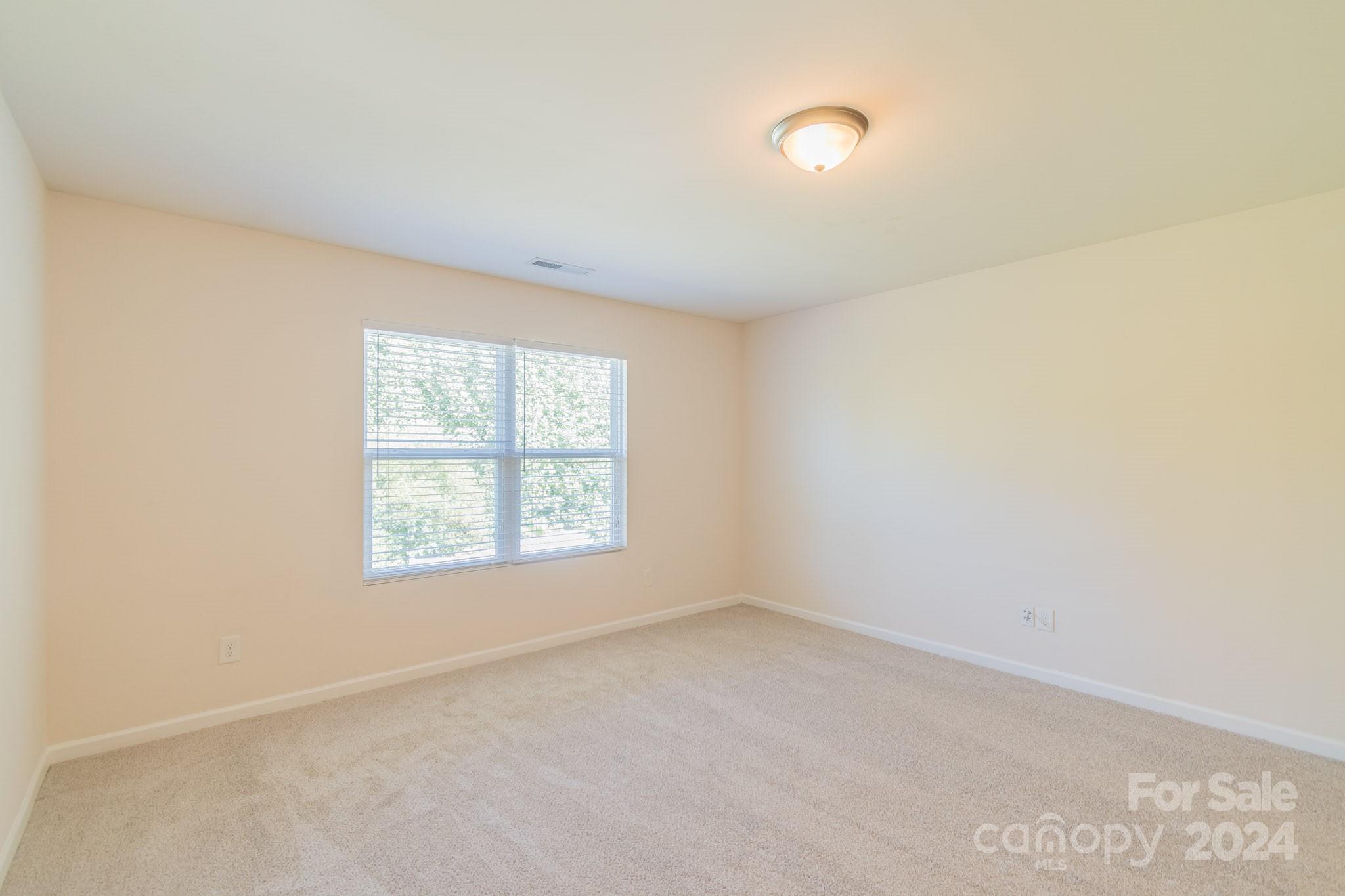8715 Balsam Bay Road Charlotte, NC 28227 - Photo 16 of 29 an empty room with a window