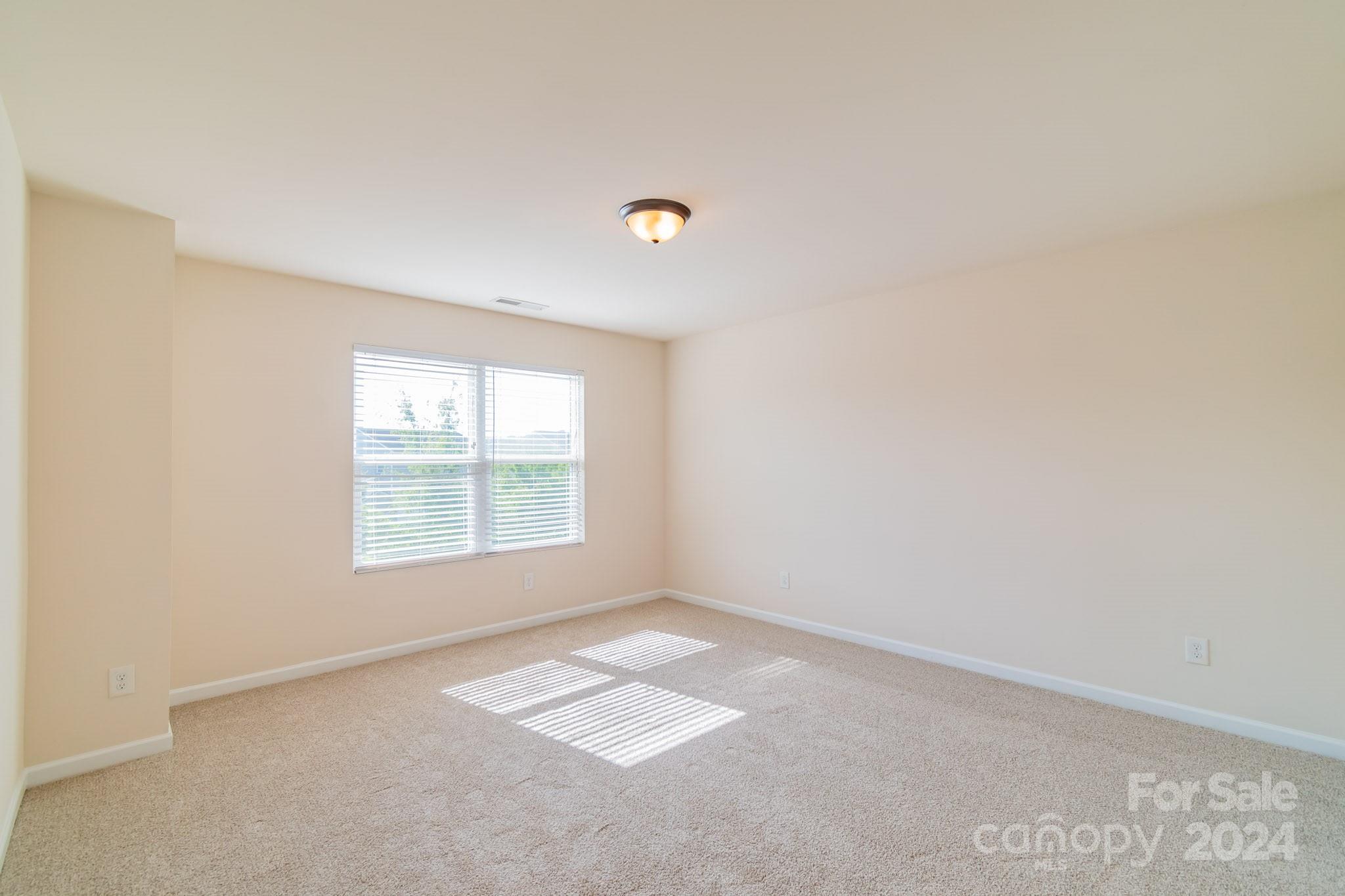 8715 Balsam Bay Road Charlotte, NC 28227 - Photo 18 of 29 an empty room with a window