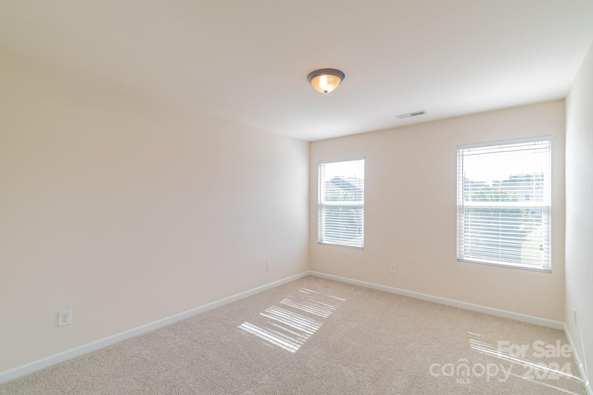 8715 Balsam Bay Road Charlotte, NC 28227 - Photo 19 of 29 a view of an empty room with a window