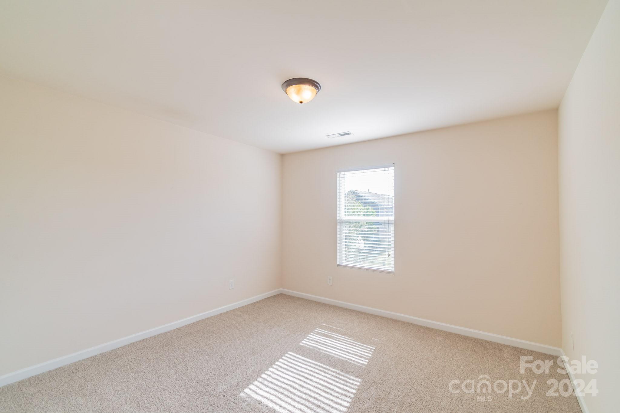 8715 Balsam Bay Road Charlotte, NC 28227 - Photo 20 of 29 an empty room with windows