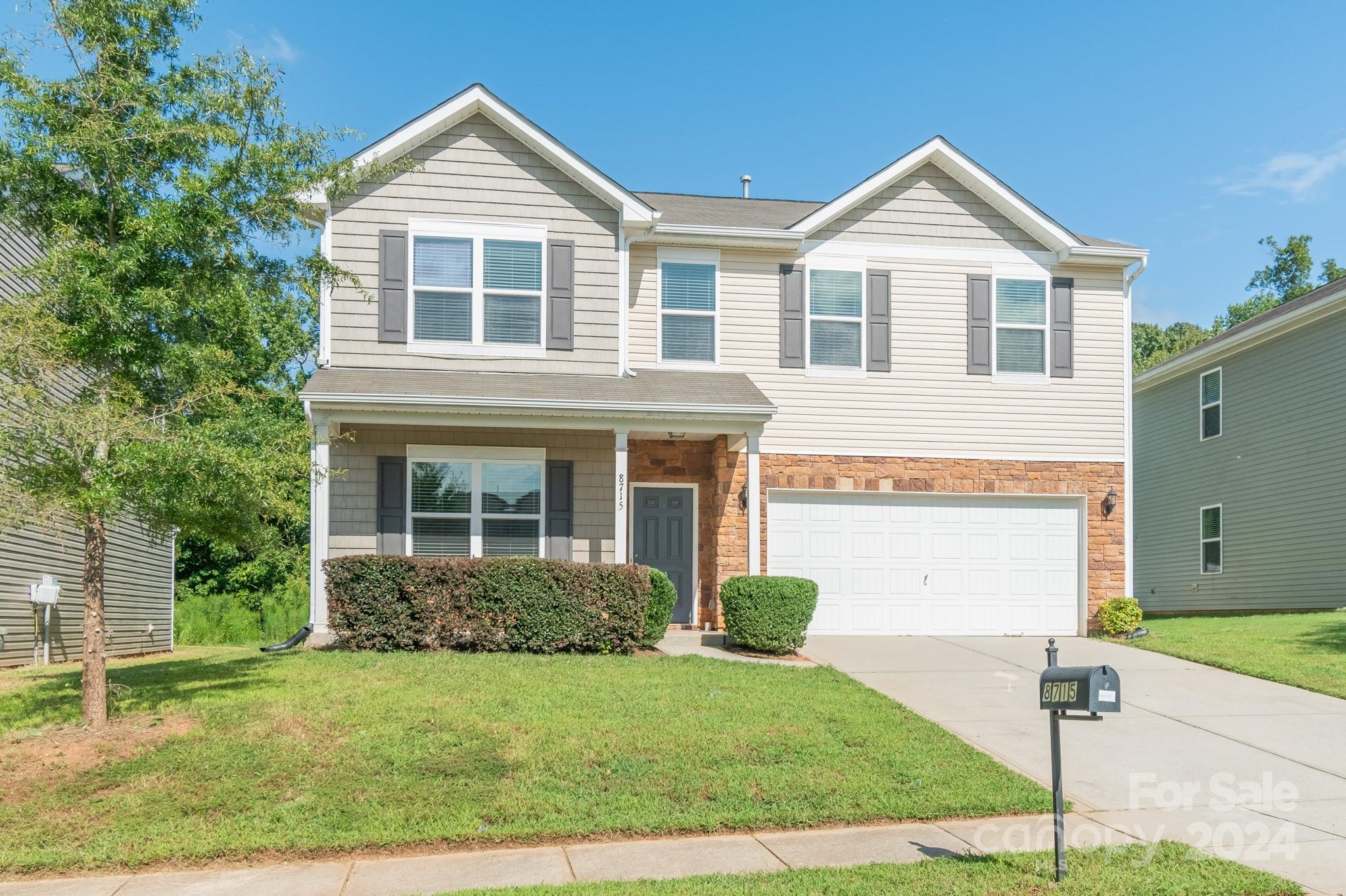 8715 Balsam Bay Road Charlotte, NC 28227 - Photo 2 of 29 a front view of a house with garden