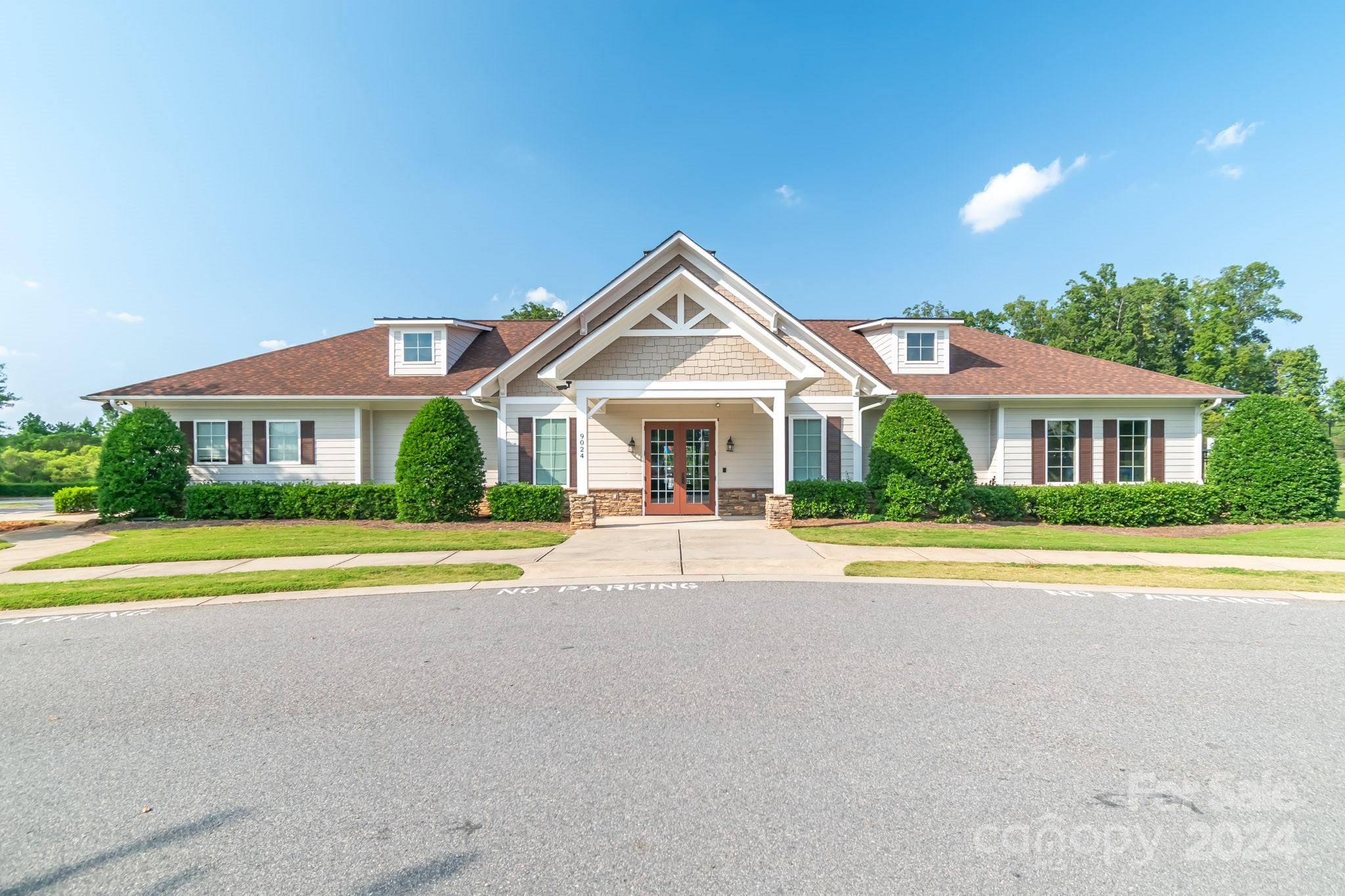 8715 Balsam Bay Road Charlotte, NC 28227 - Photo 24 of 29 a front view of a house with a yard and a garage