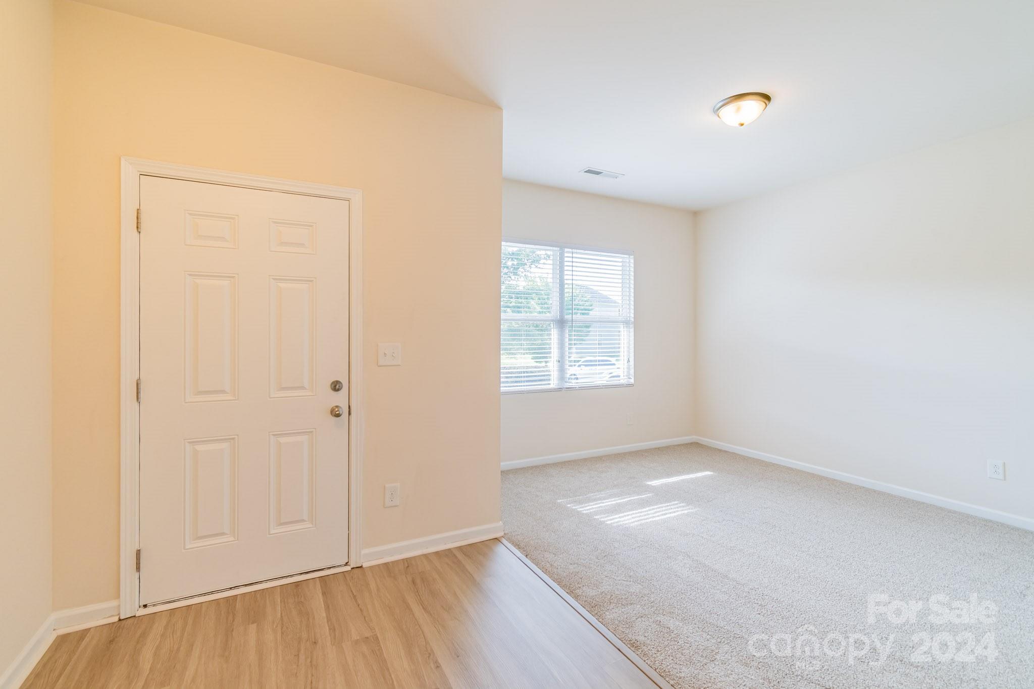 8715 Balsam Bay Road Charlotte, NC 28227 - Photo 4 of 29 an empty room with windows and closet