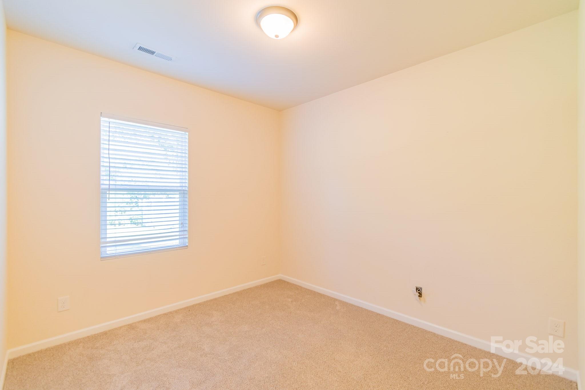 8715 Balsam Bay Road Charlotte, NC 28227 - Photo 9 of 29 a view of an empty room with a window