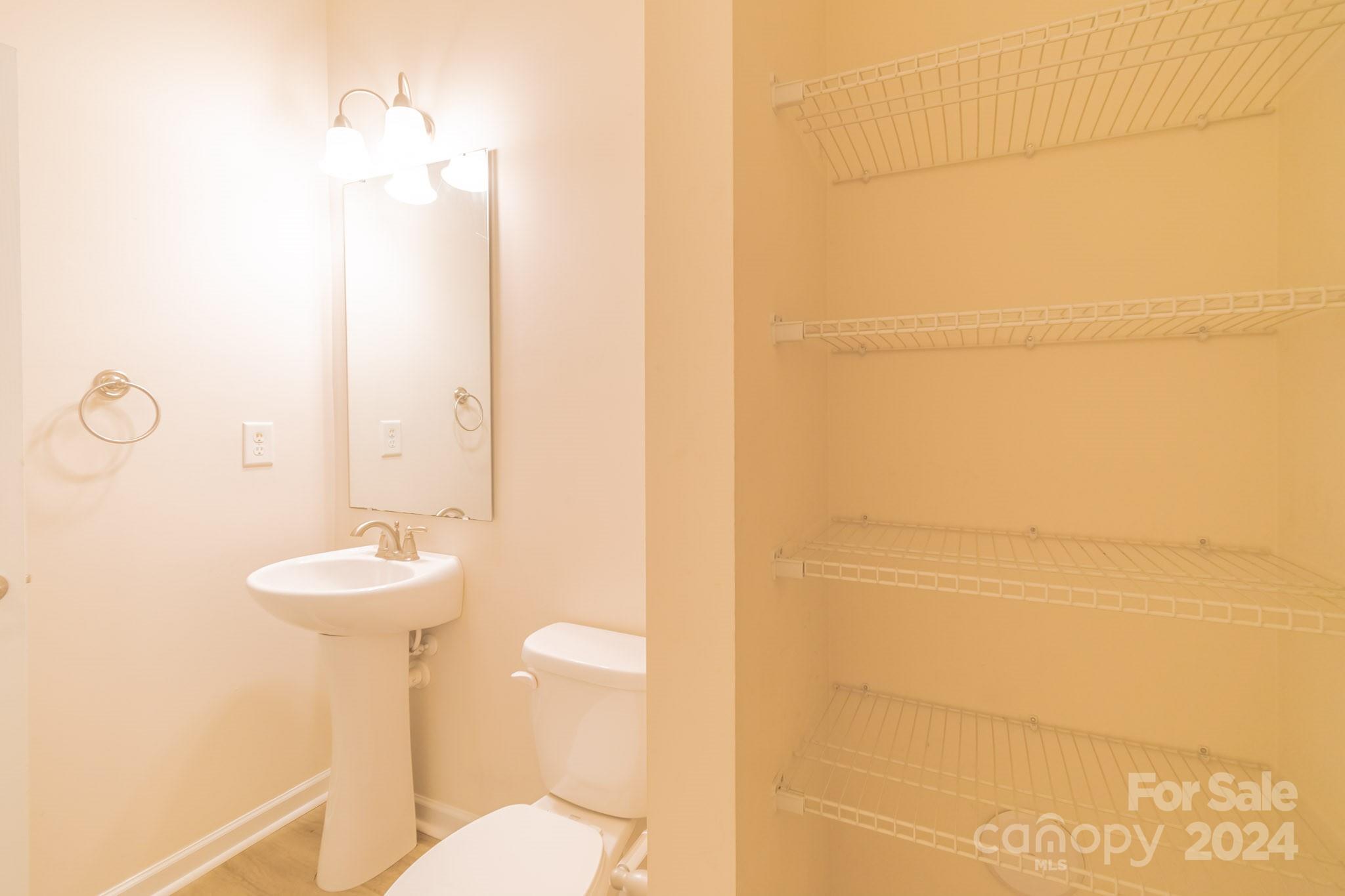 8715 Balsam Bay Road Charlotte, NC 28227 - Photo 10 of 29 a bathroom with a sink and a mirror