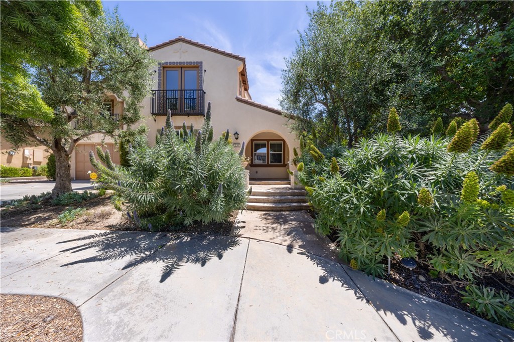 130 Yellow Daisy Irvine, CA 92618 - Photo 2 of 48 a front view of a house with garden