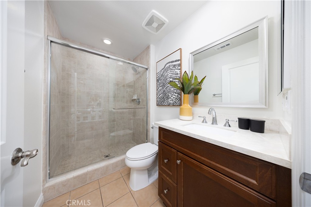 130 Yellow Daisy Irvine, CA 92618 - Photo 9 of 48 a bathroom with a sink a toilet and shower