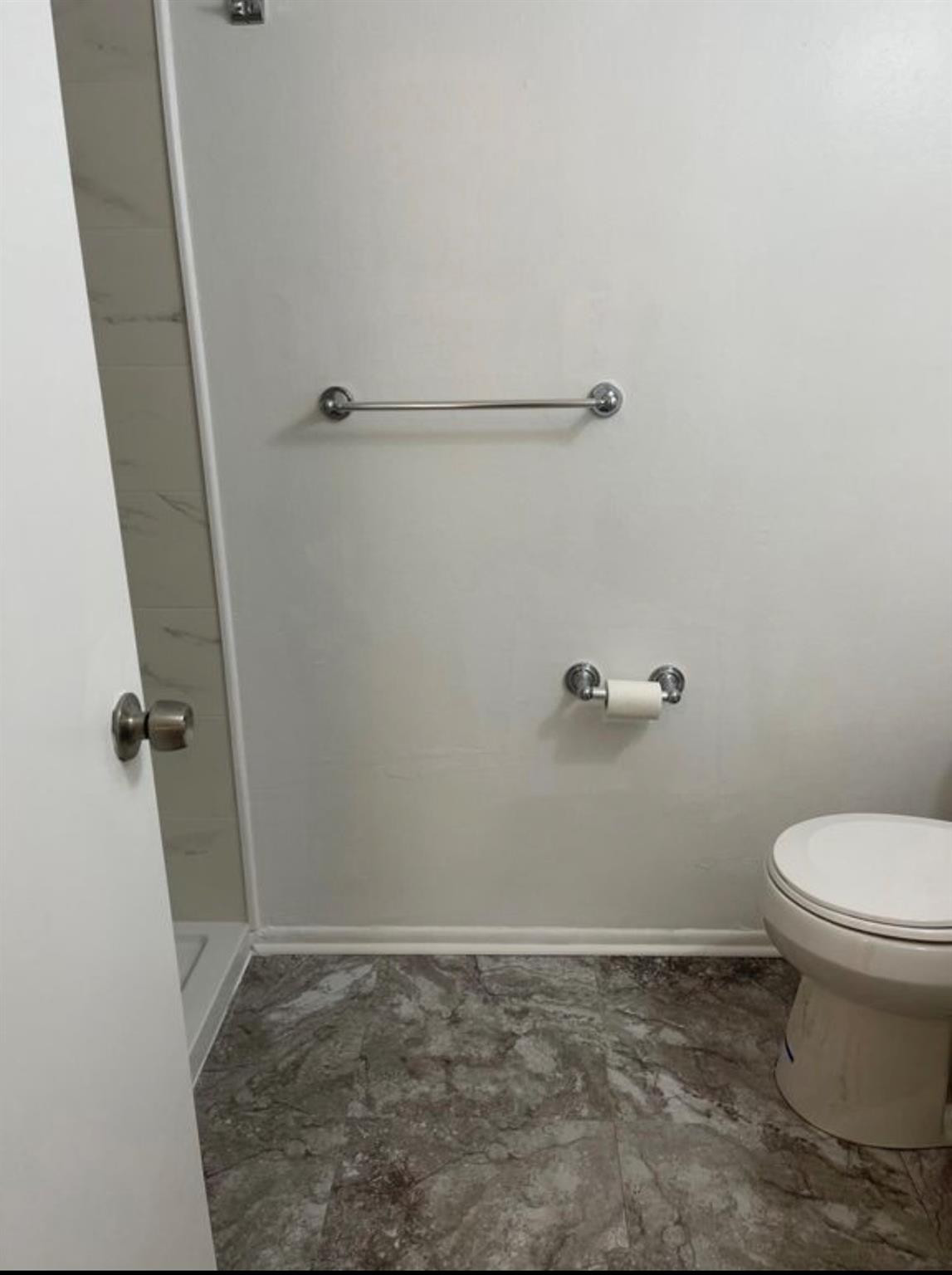 2701 Riverside Drive, Unit 107B Coral Springs, FL 33065 - Photo 8 of 13 a bathroom with a granite countertop toilet and a sink