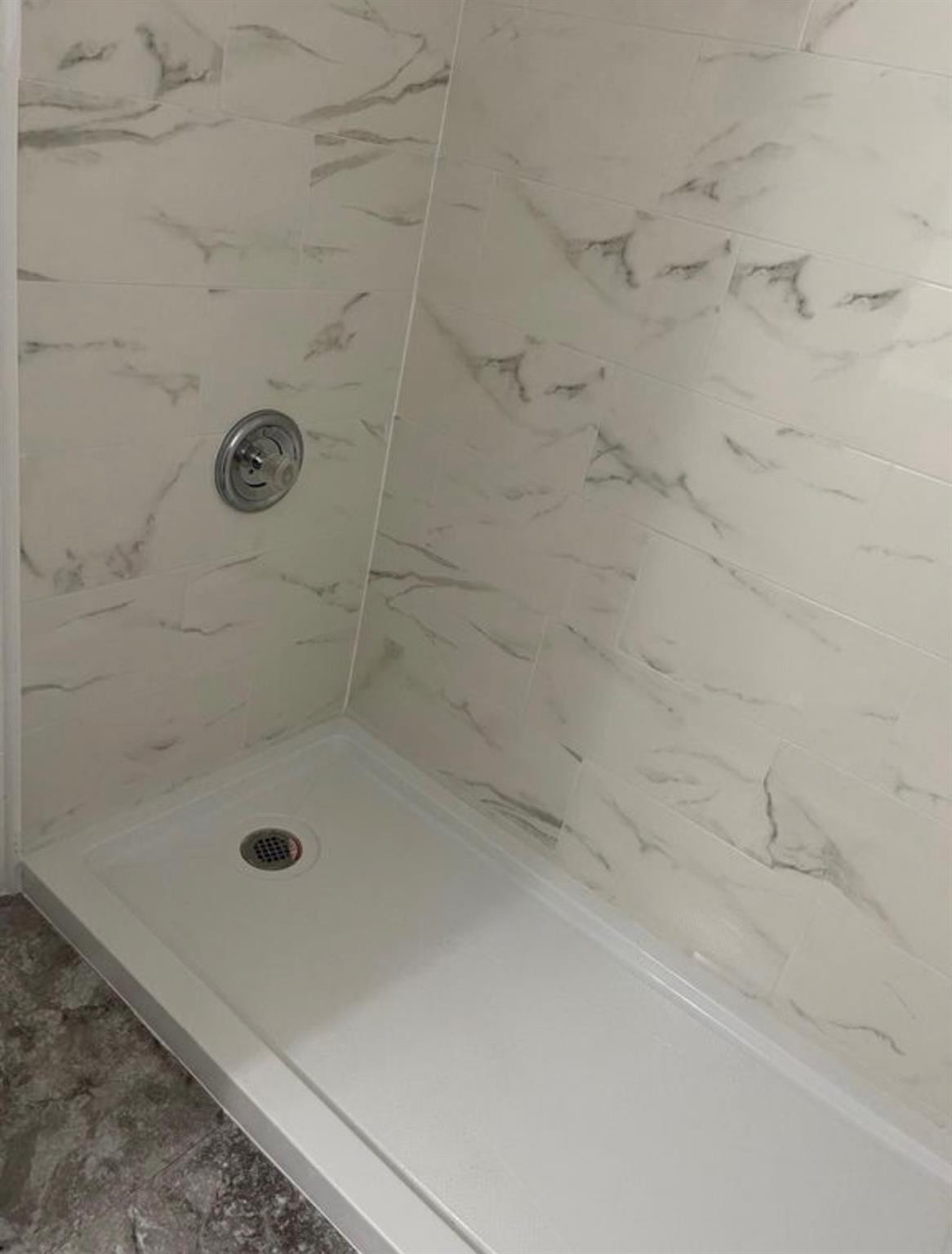 2701 Riverside Drive, Unit 107B Coral Springs, FL 33065 - Photo 10 of 13 a bathroom with a shower