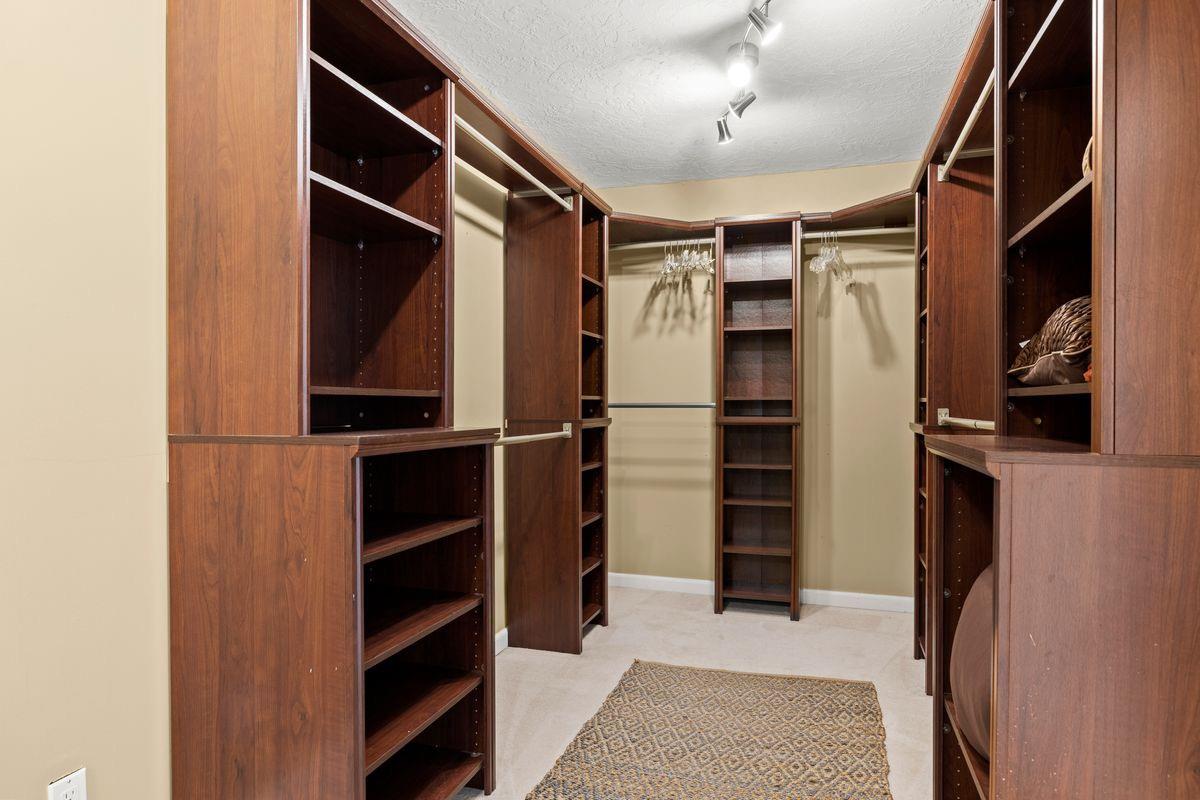 2230 South Rice Road Ojai, CA 93023 - Photo 13 of 26 a view of walk in closet with clothes and shoes
