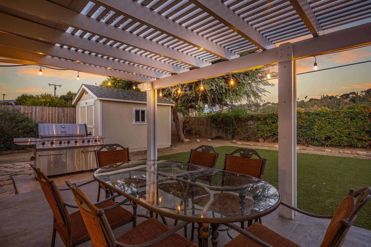 2230 South Rice Road Ojai, CA 93023 - Photo 21 of 26 a patio with yard glass top table and chairs