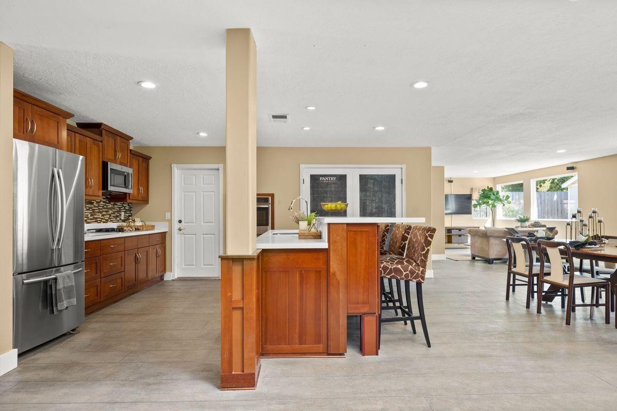 2230 South Rice Road Ojai, CA 93023 - Photo 4 of 26 a living room with stainless steel appliances kitchen island granite countertop furniture and a kitchen view