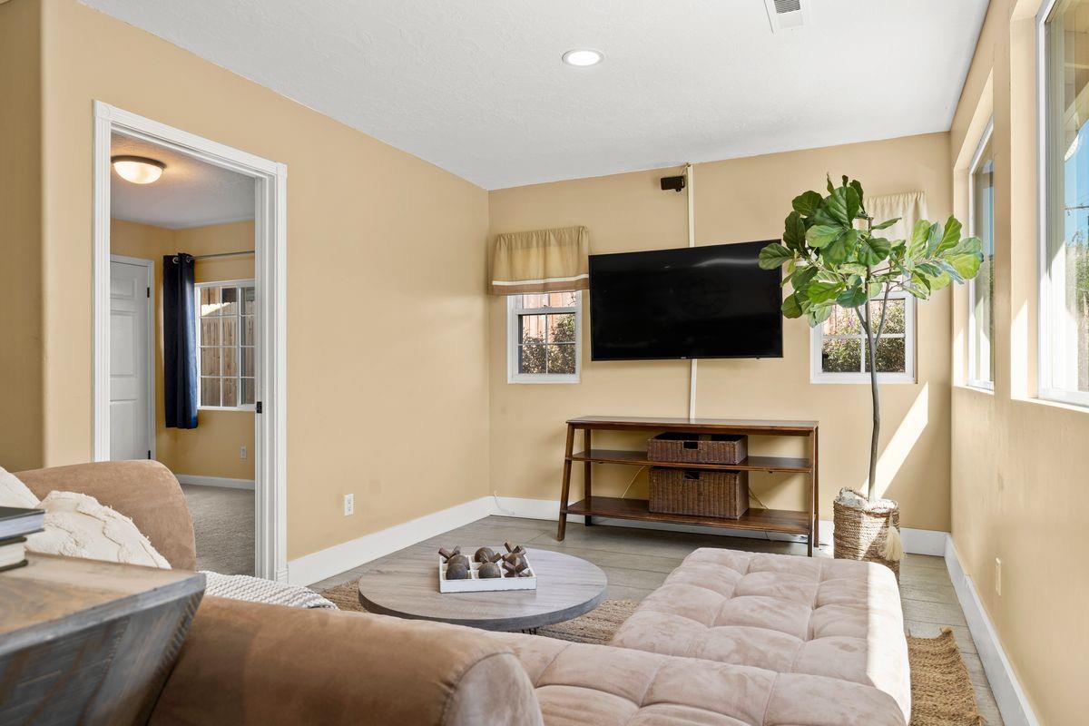 2230 South Rice Road Ojai, CA 93023 - Photo 10 of 26 a living room with furniture and a flat screen tv