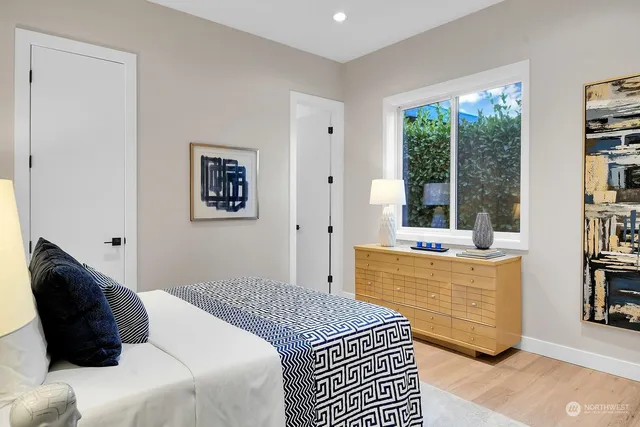 a dining room with furniture and a window