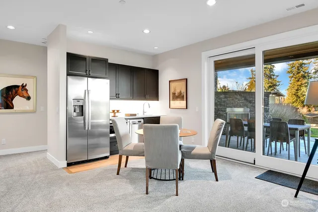 a view of a house with backyard porch and sitting area