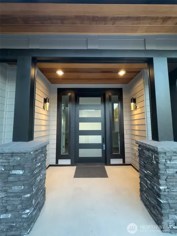a kitchen with sink attached with living room
