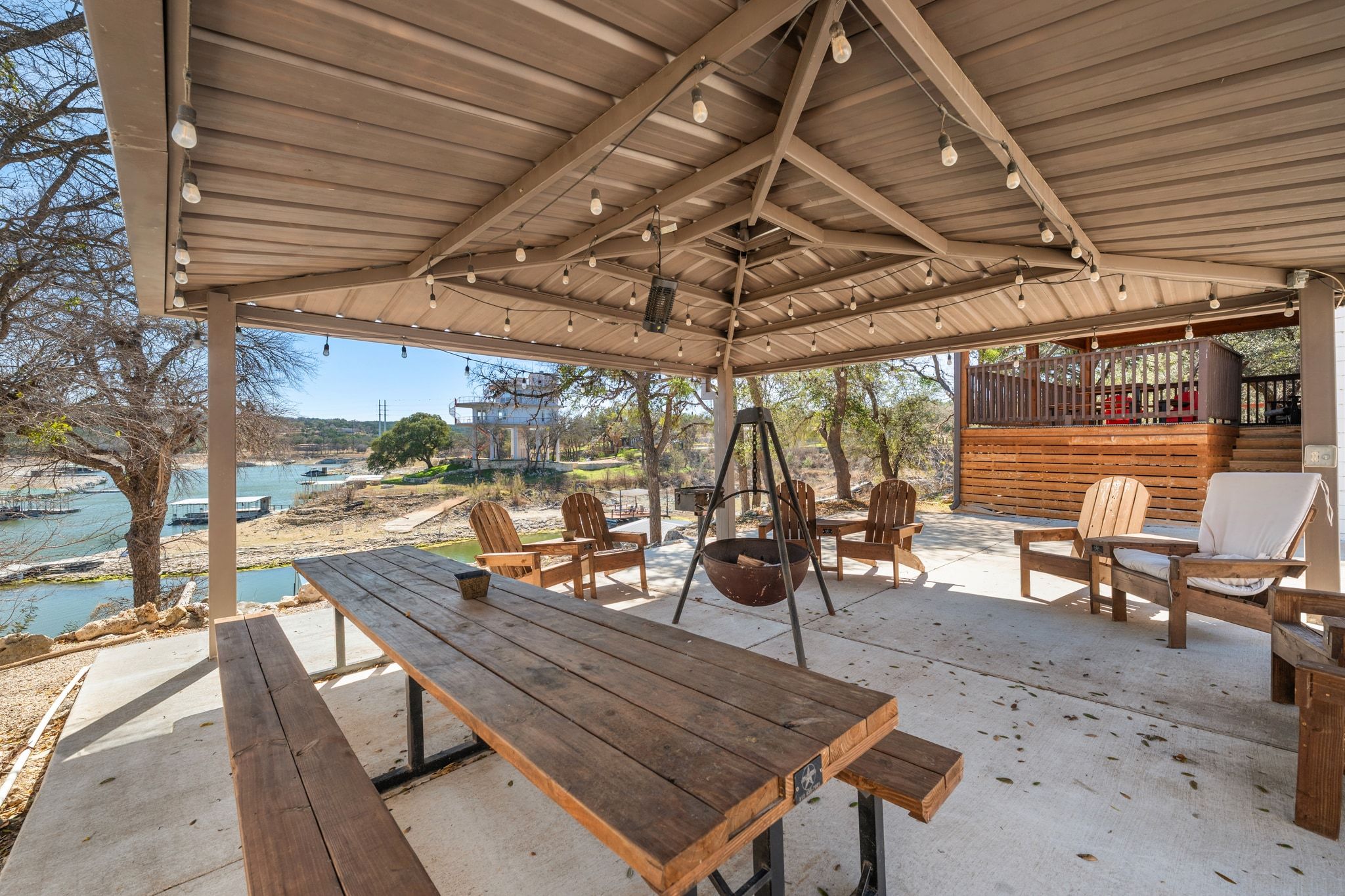 2903 Oak Ridge Drive Spicewood, TX 78669 - Photo 27 of 33 View of patio / terrace featuring a water view and an outdoor fire pit