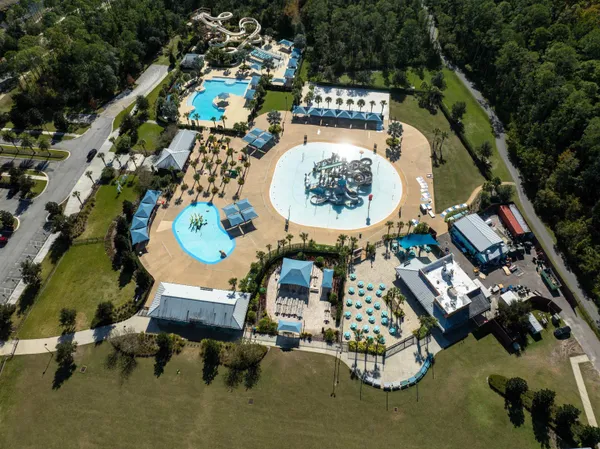 an aerial view of a chairs and table in the patio