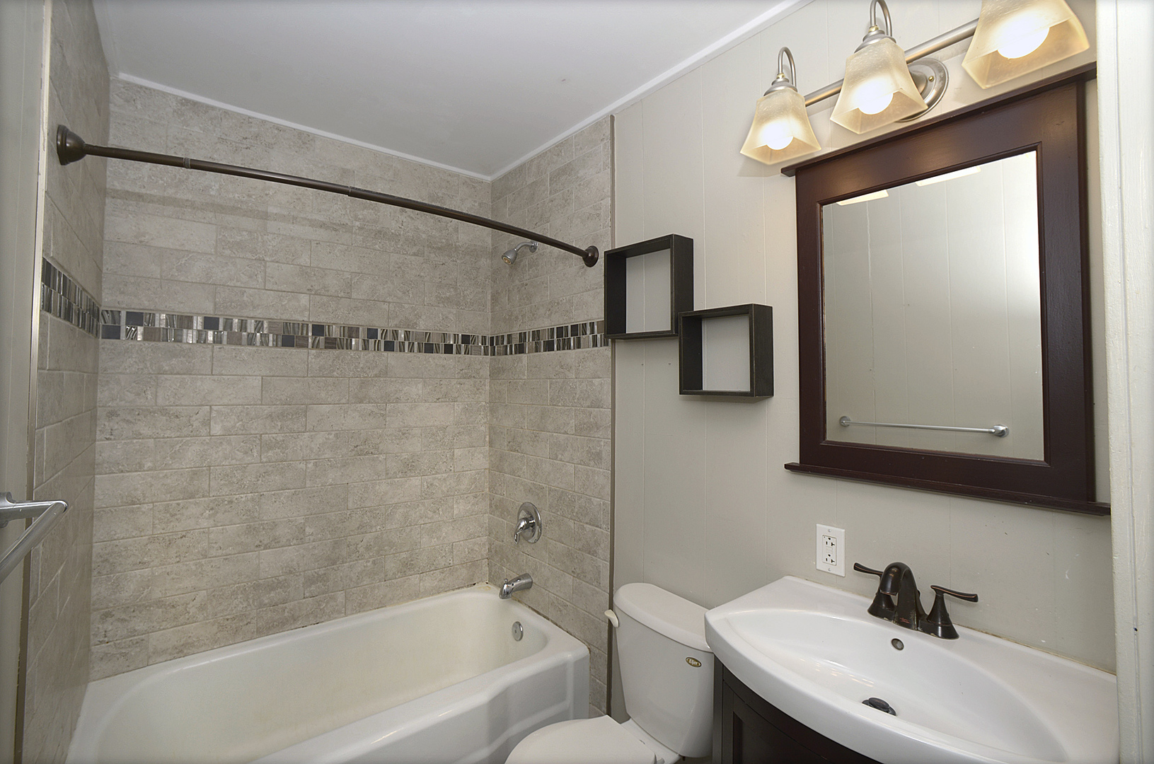 736 Westwood Drive Ottawa, IL 61350 - Photo 8 of 15 a bathroom with a sink a mirror and a shower