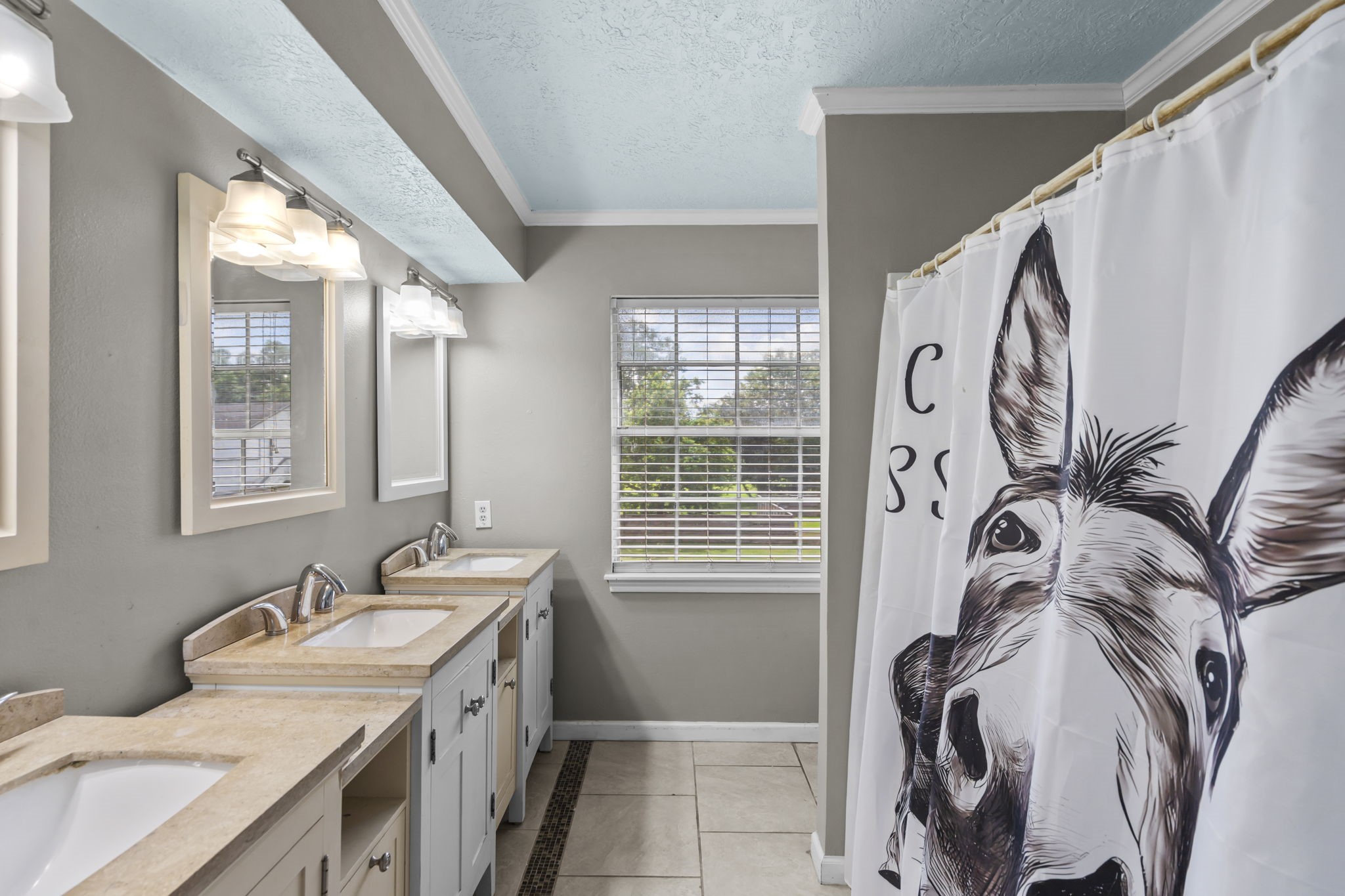 7009 Avenue R Santa Fe, TX 77510 - Photo 25 of 48 Secondary bathroom has plenty of sinks for everyone!