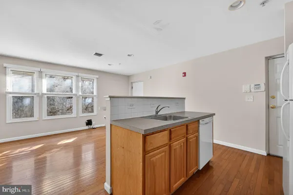 a kitchen with a sink stove and refrigerator