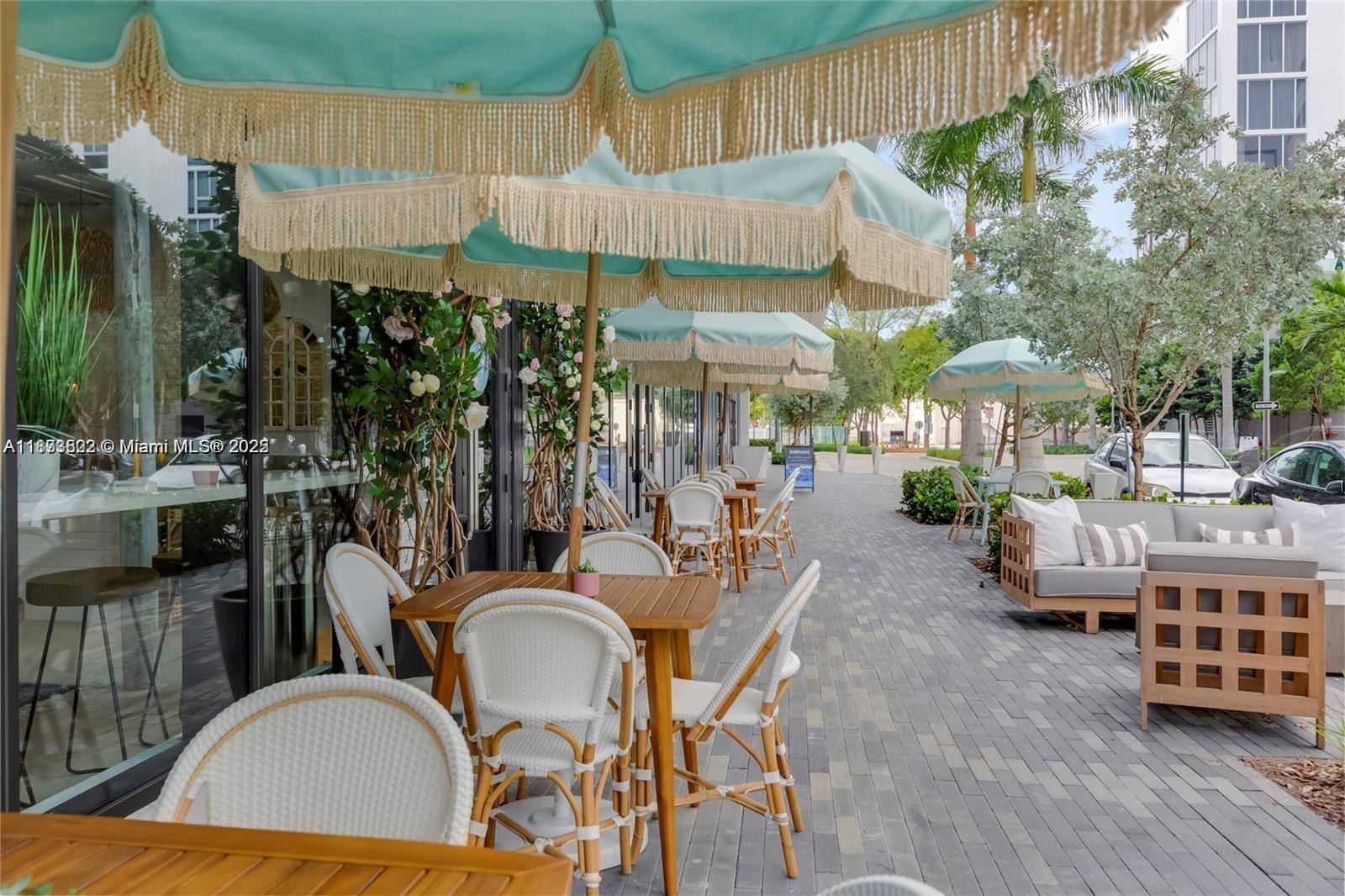 2960 Northeast 207th Street, Unit 1106 Aventura, FL 33180 - Photo 14 of 31 a view of a chairs and table in patio