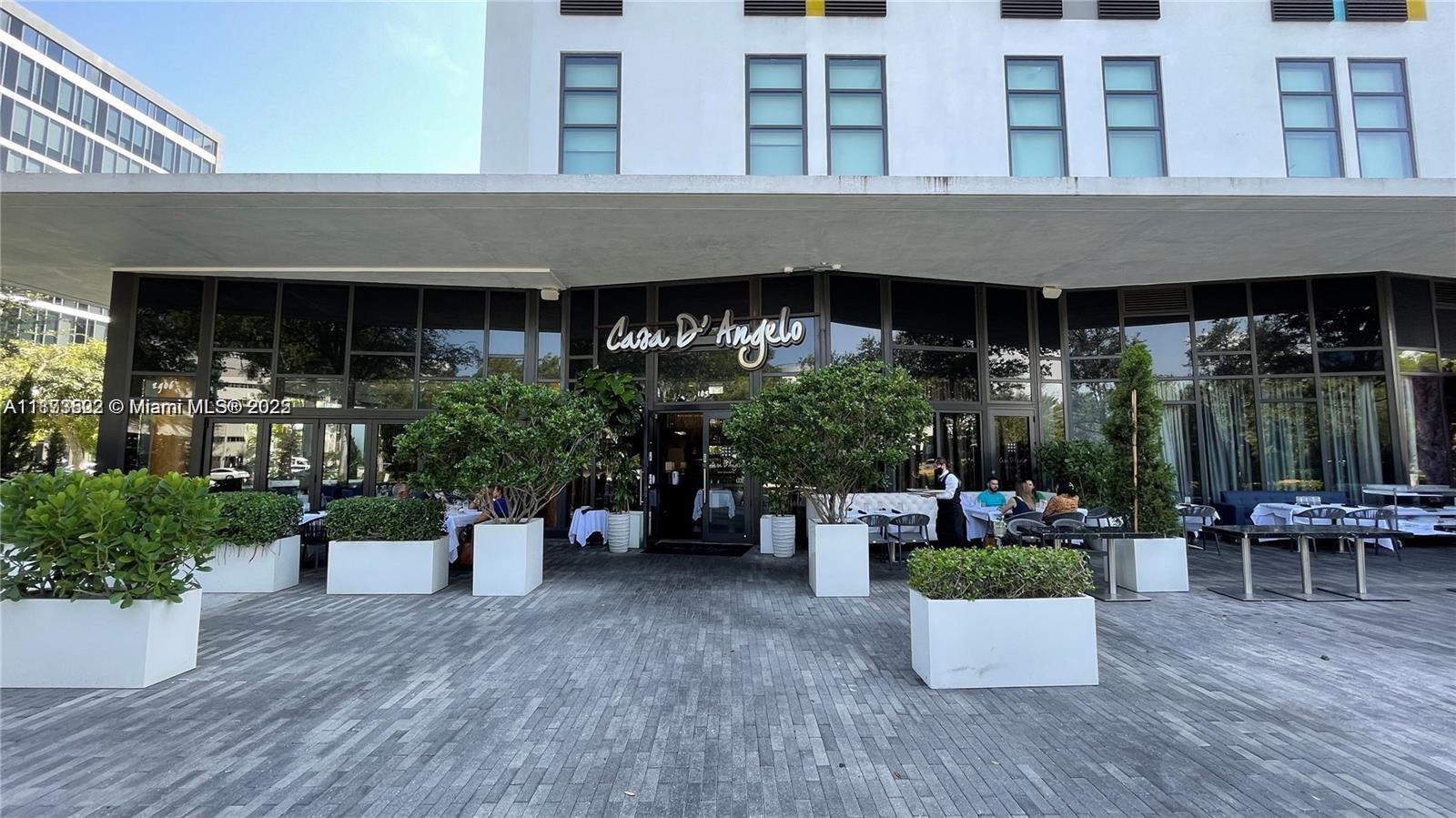 2960 Northeast 207th Street, Unit 1106 Aventura, FL 33180 - Photo 15 of 31 a view of a house with sitting area and potted plants