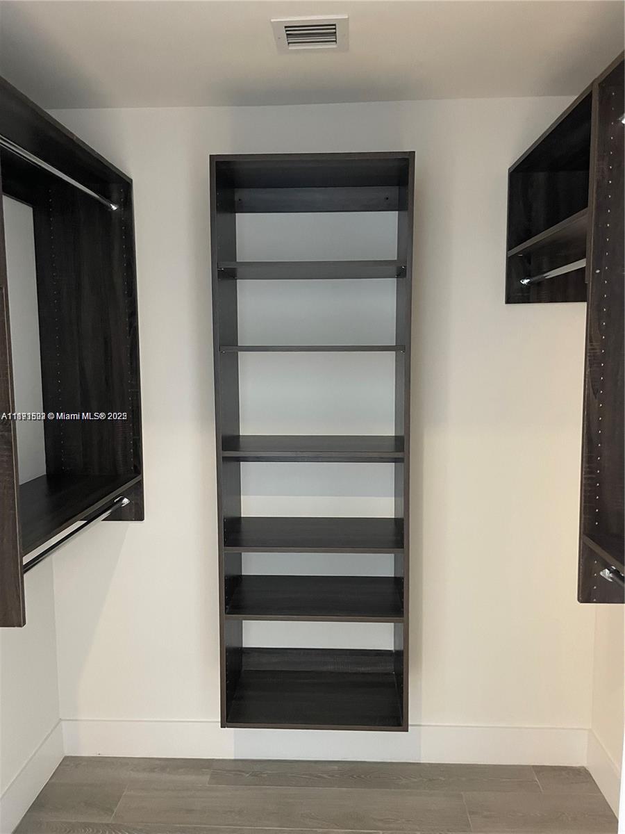 2960 Northeast 207th Street, Unit 1106 Aventura, FL 33180 - Photo 25 of 31 a view of walk in closet