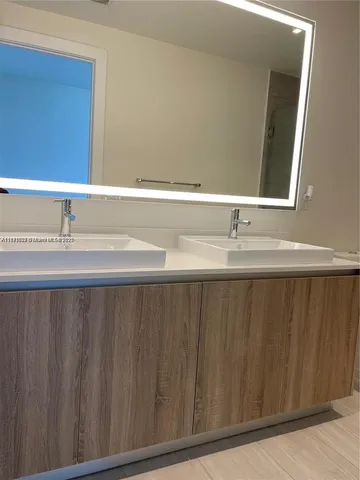 a bathroom with a shower and a toilet