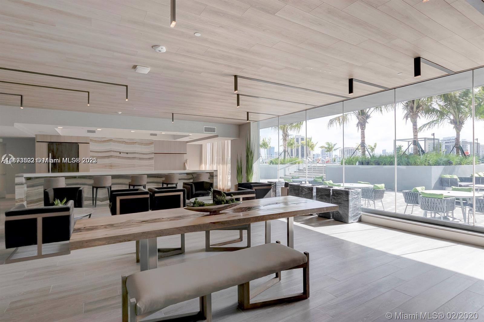 2960 Northeast 207th Street, Unit 1106 Aventura, FL 33180 - Photo 9 of 31 a living room with furniture and a large window