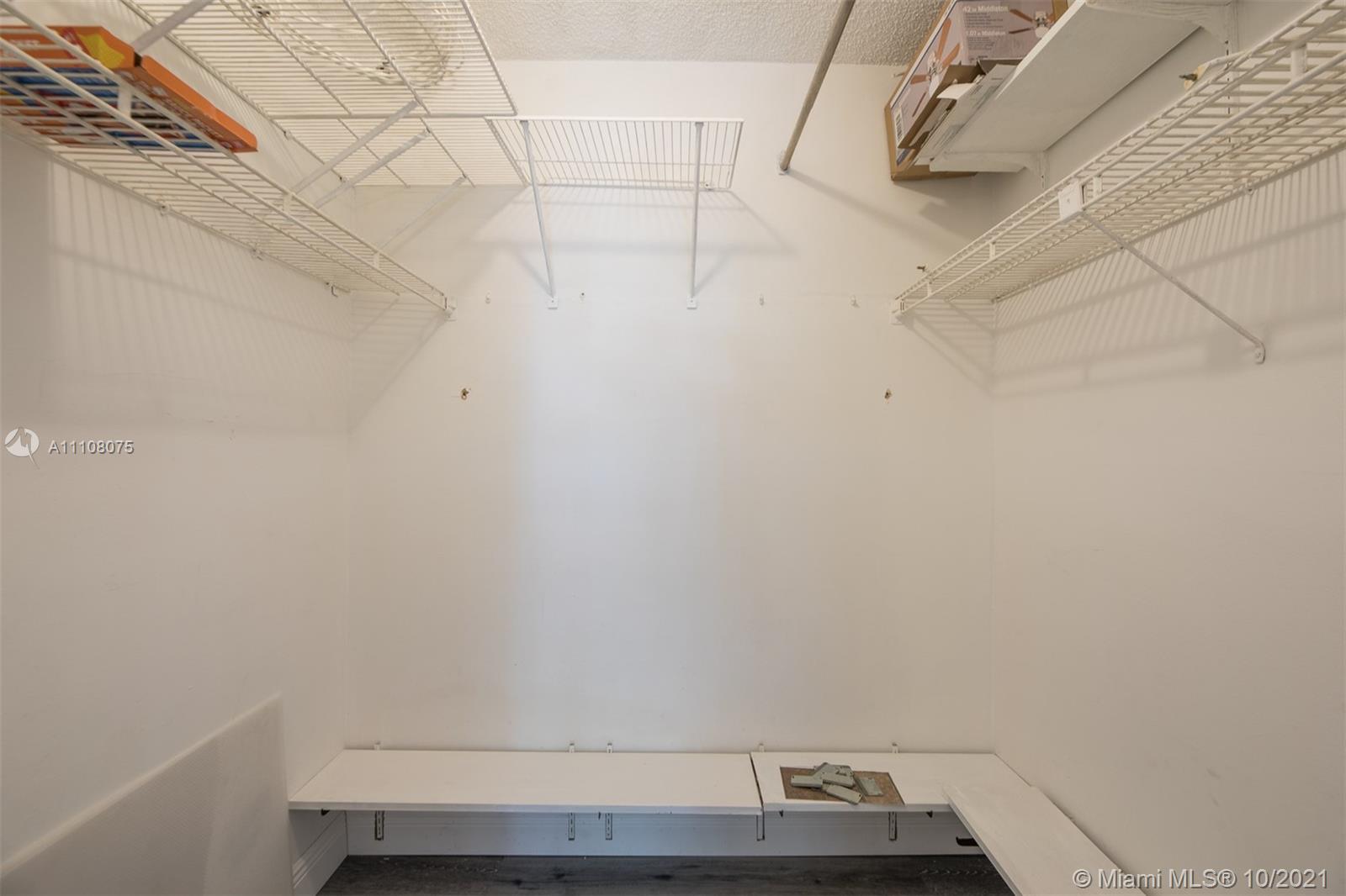 200 172nd Street, Unit 317 Sunny Isles Beach, FL 33160 - Photo 22 of 27 a view of small space with racks on the wall