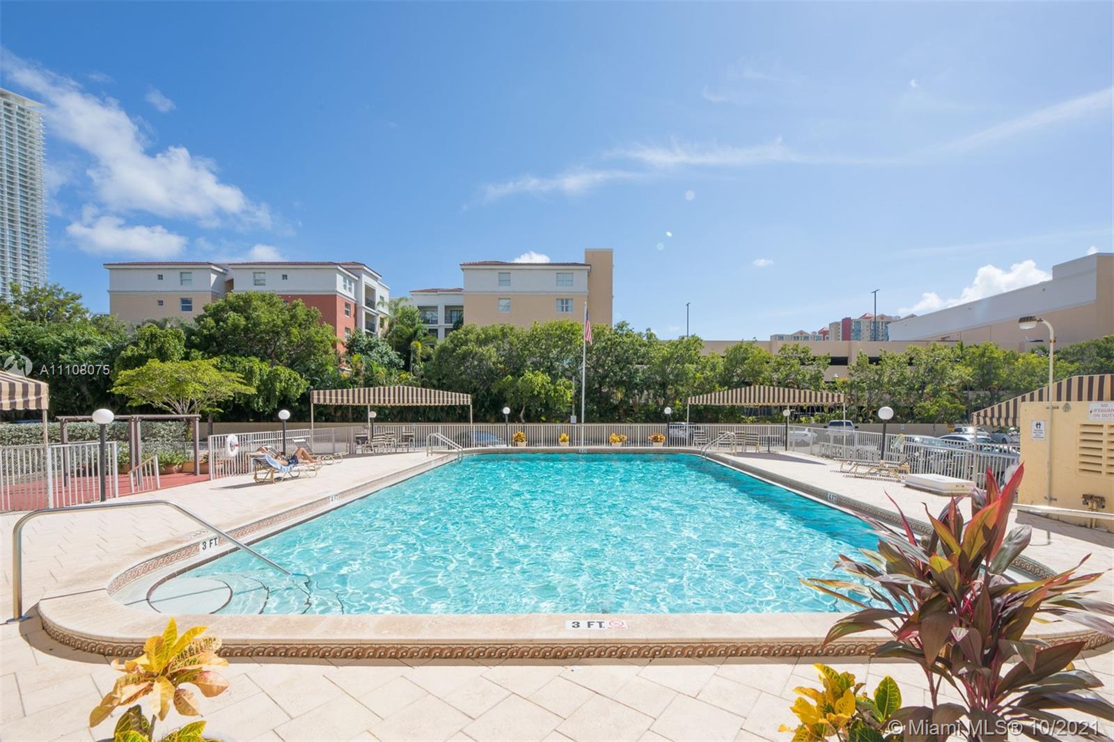 200 172nd Street, Unit 317 Sunny Isles Beach, FL 33160 - Photo 24 of 27 a view of a swimming pool and outdoor space