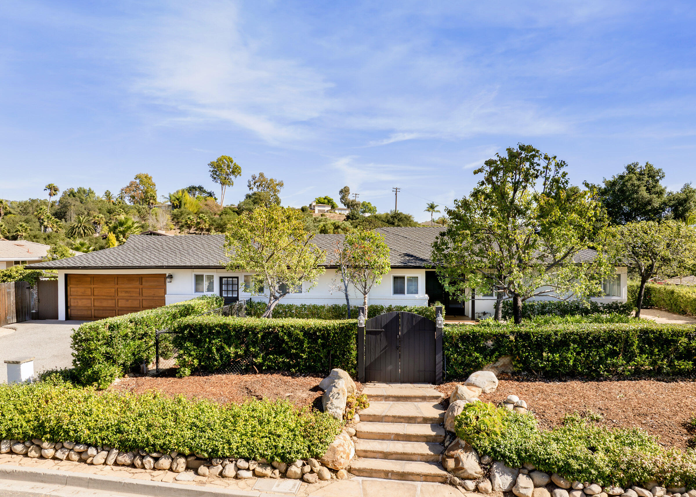 42 Northridge Road Santa Barbara, CA 93105 - Photo 2 of 22 a front view of a house with a yard