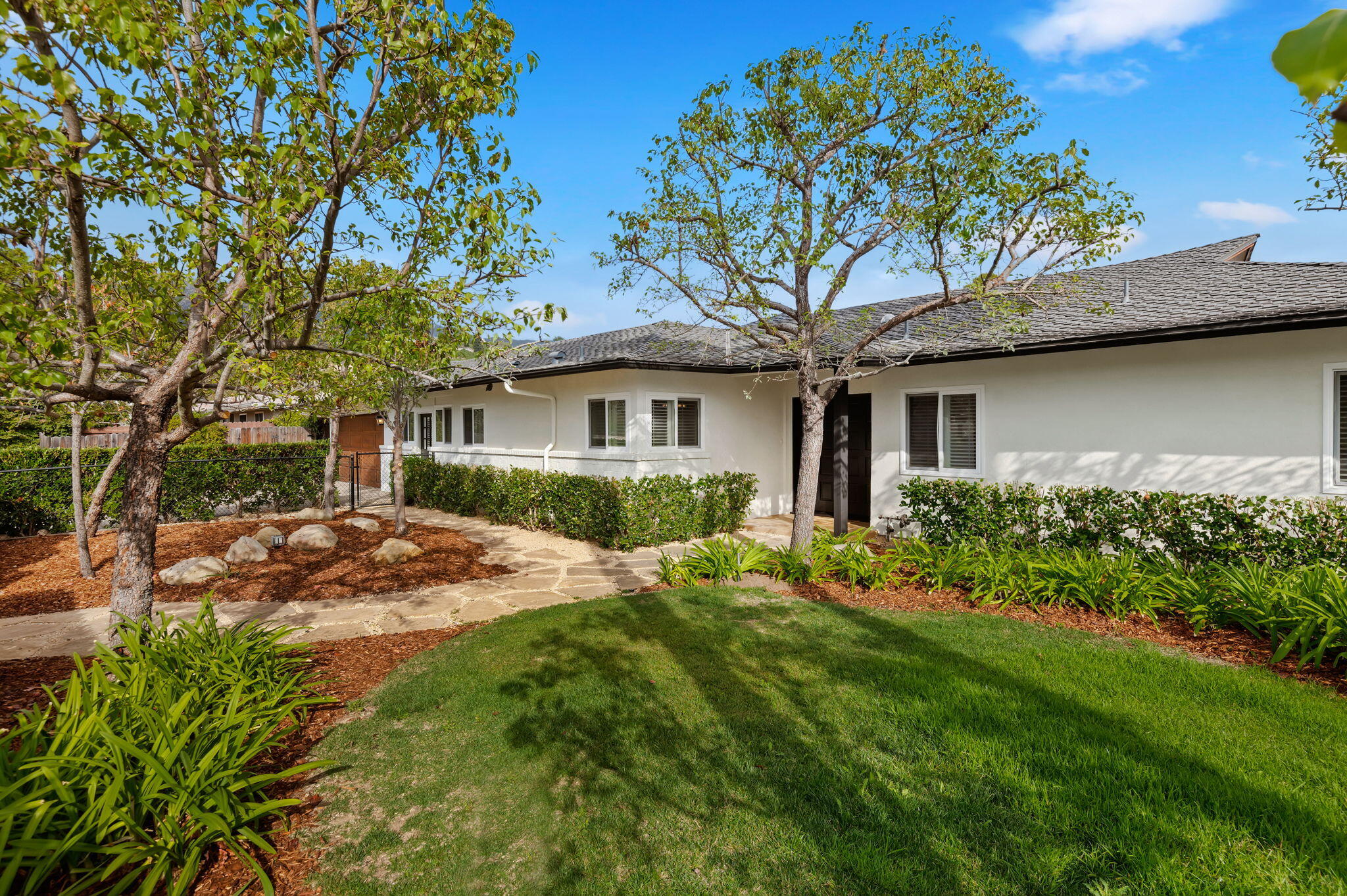 42 Northridge Road Santa Barbara, CA 93105 - Photo 3 of 22 a view of a house with a yard and potted plants