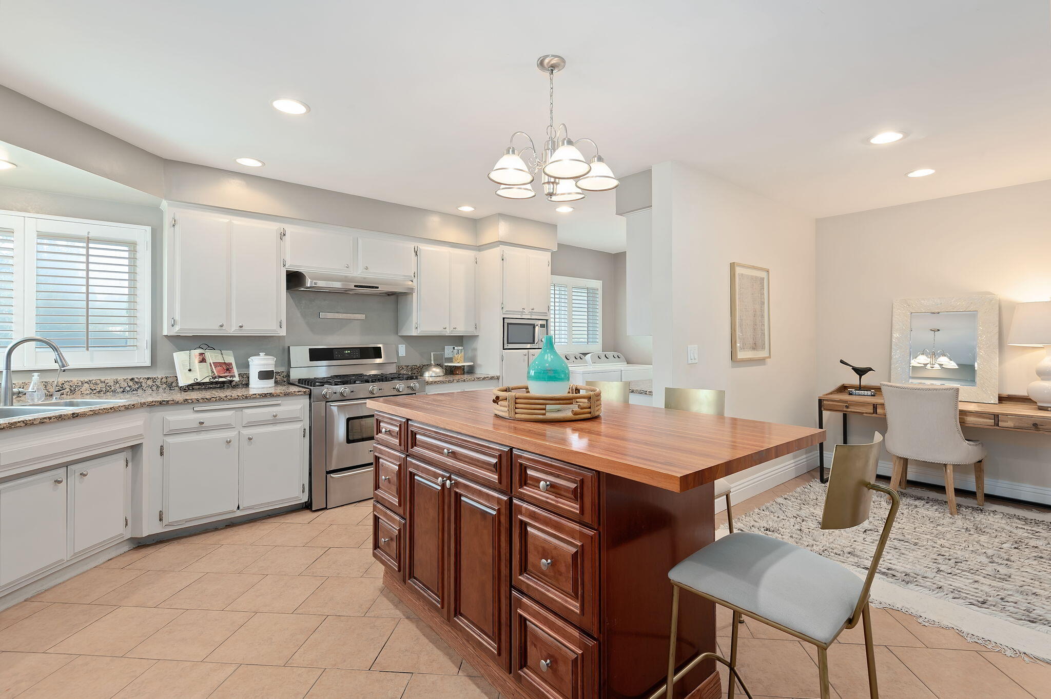 42 Northridge Road Santa Barbara, CA 93105 - Photo 8 of 22 a room with stainless steel appliances kitchen island granite countertop a sink a stove a dining table and chairs