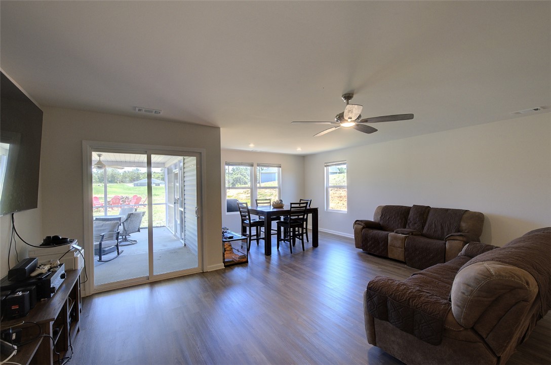 408 Chadwick Lane Walhalla, SC 29691 - Photo 42 of 44 An open floorplan living area flows seamlessly to a screened patio, ideal for indoor-outdoor living.