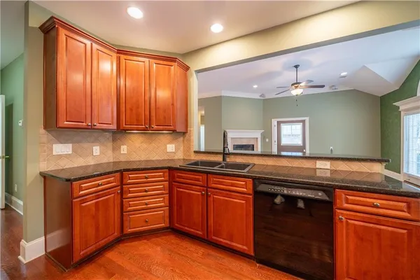 a kitchen with a sink and cabinets