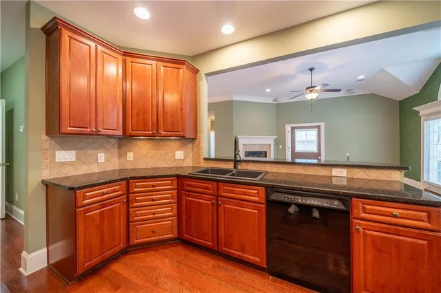 a kitchen with a sink and cabinets