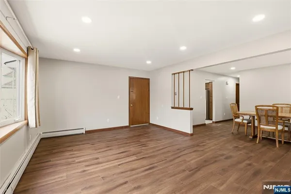 a view of livingroom with furniture and wooden floor