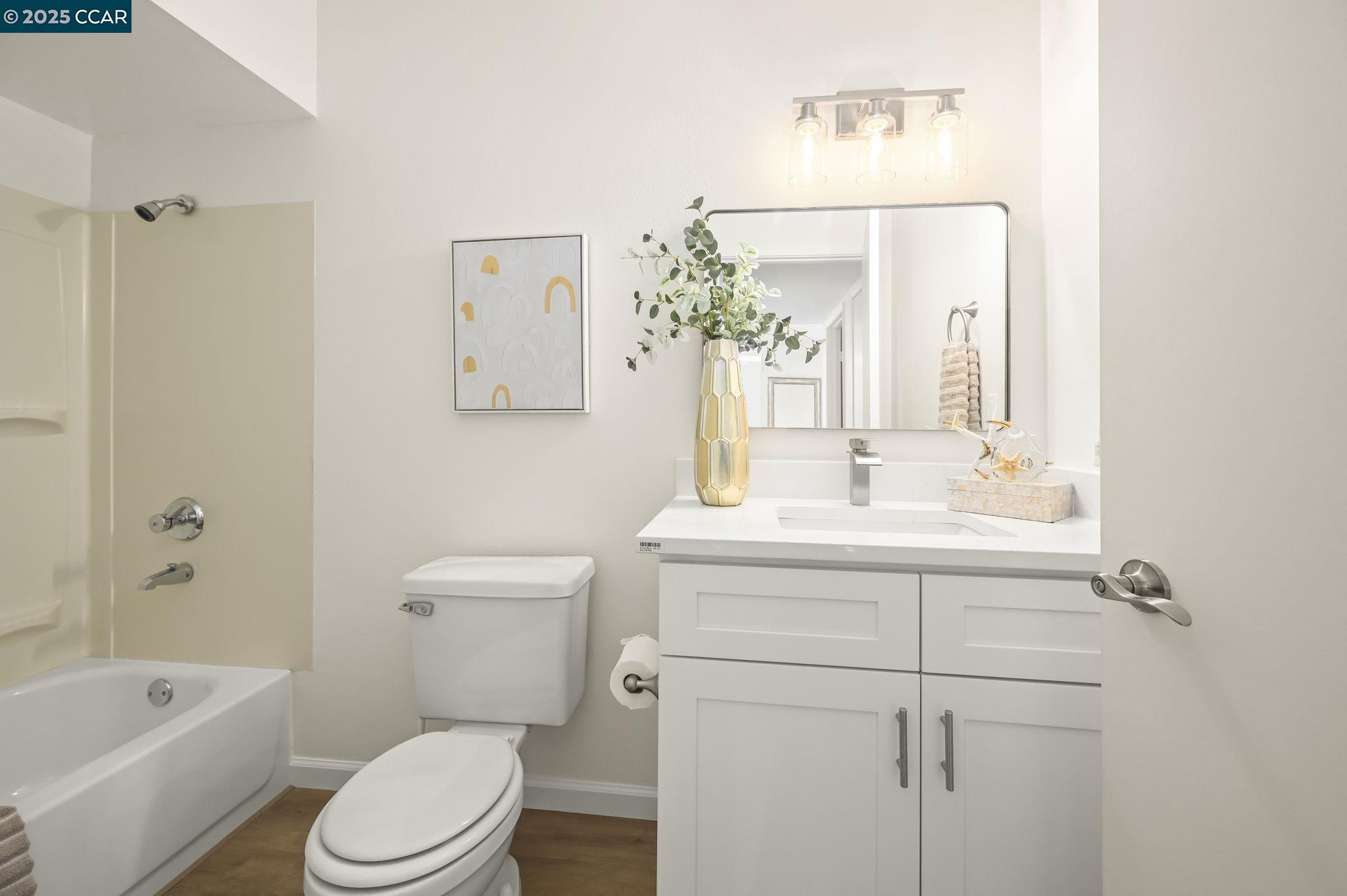 1324 Singingwood Court, Unit 3 Walnut Creek, CA 94595 - Photo 16 of 36 a bathroom with a sink a toilet and shower