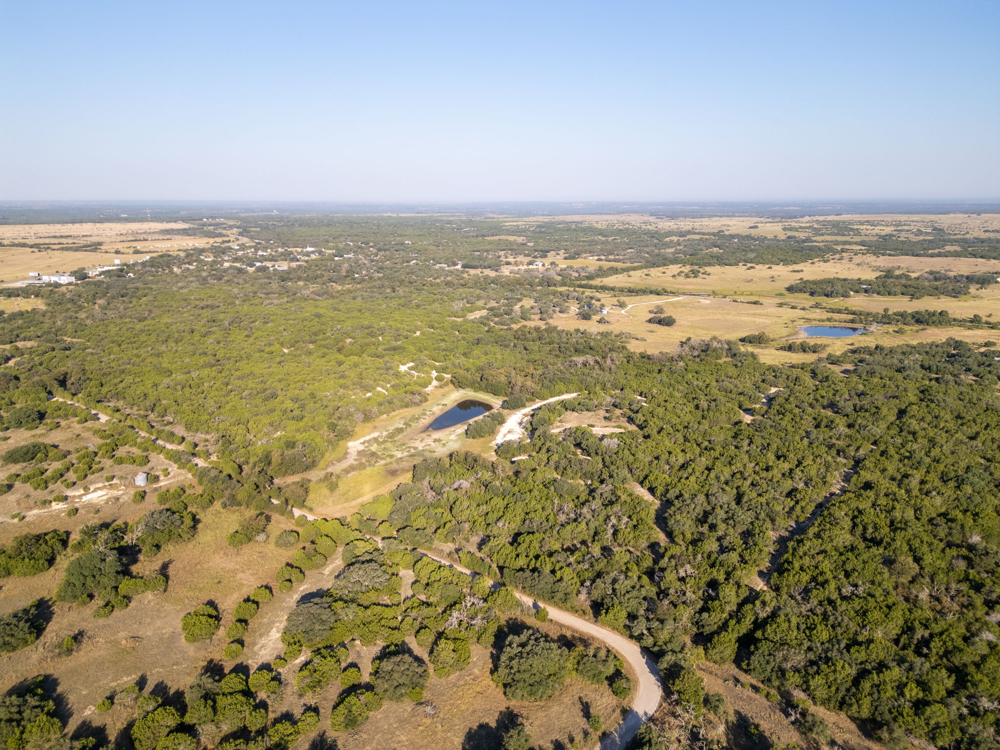 112 Loop 308 Briggs, TX 78608 - Photo 13 of 37 View of property location featuring a forest