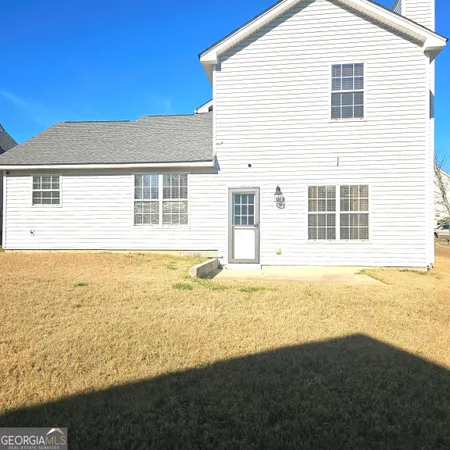 a house view with a outdoor space