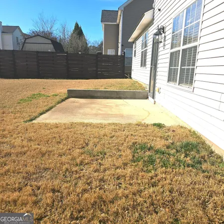 a view of a backyard of the house