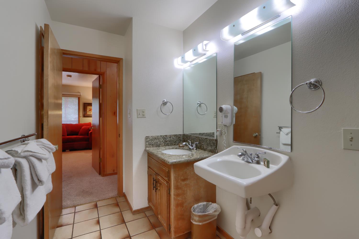 8041 Chilnualna Falls Road Wawona, CA 95389 - Photo 26 of 46 a en suite bathroom with a sink and mirror