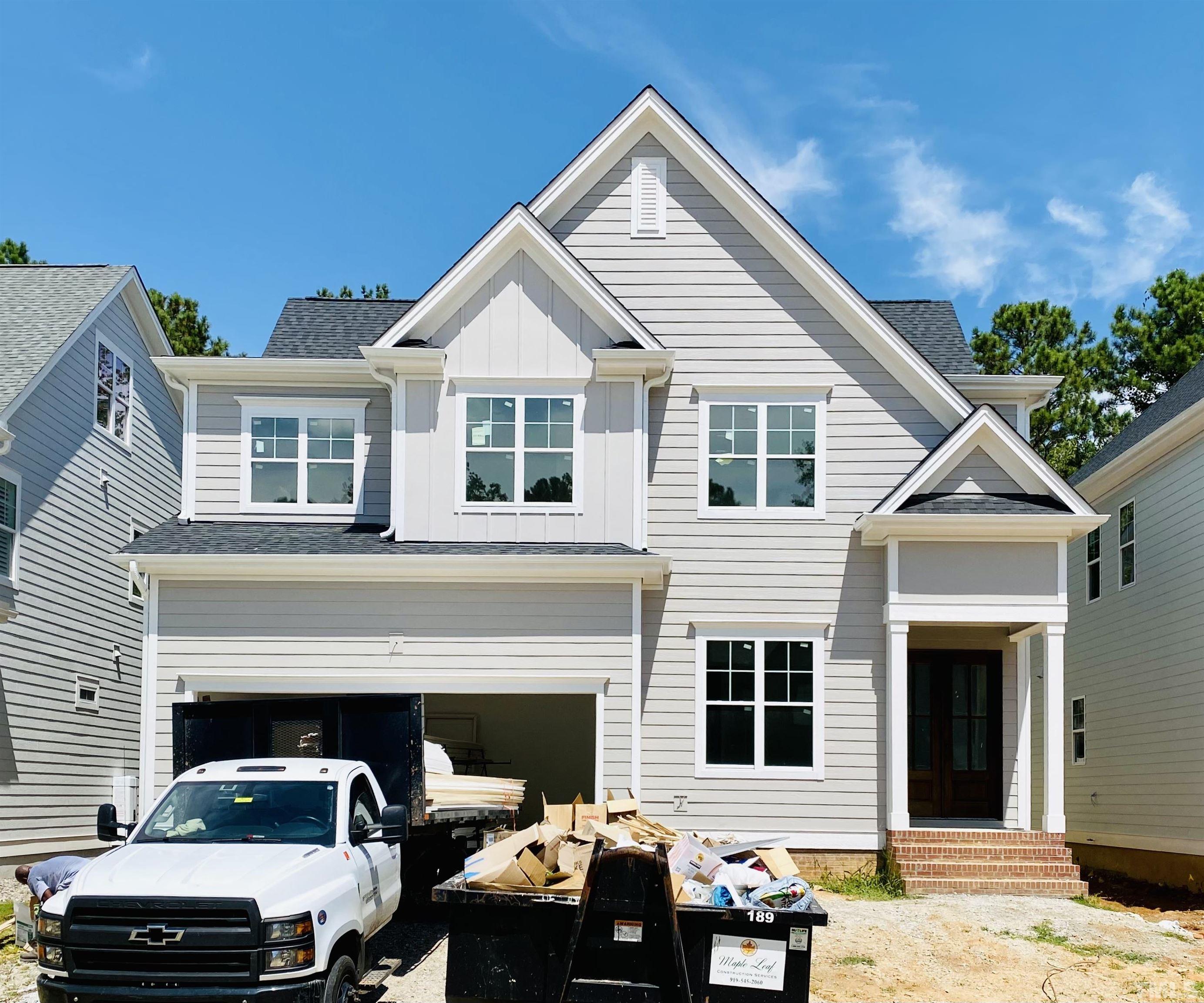 3028 Eden Harbor Court Raleigh, NC 27613 - Photo 21 of 32 a front view of a house with cars parked