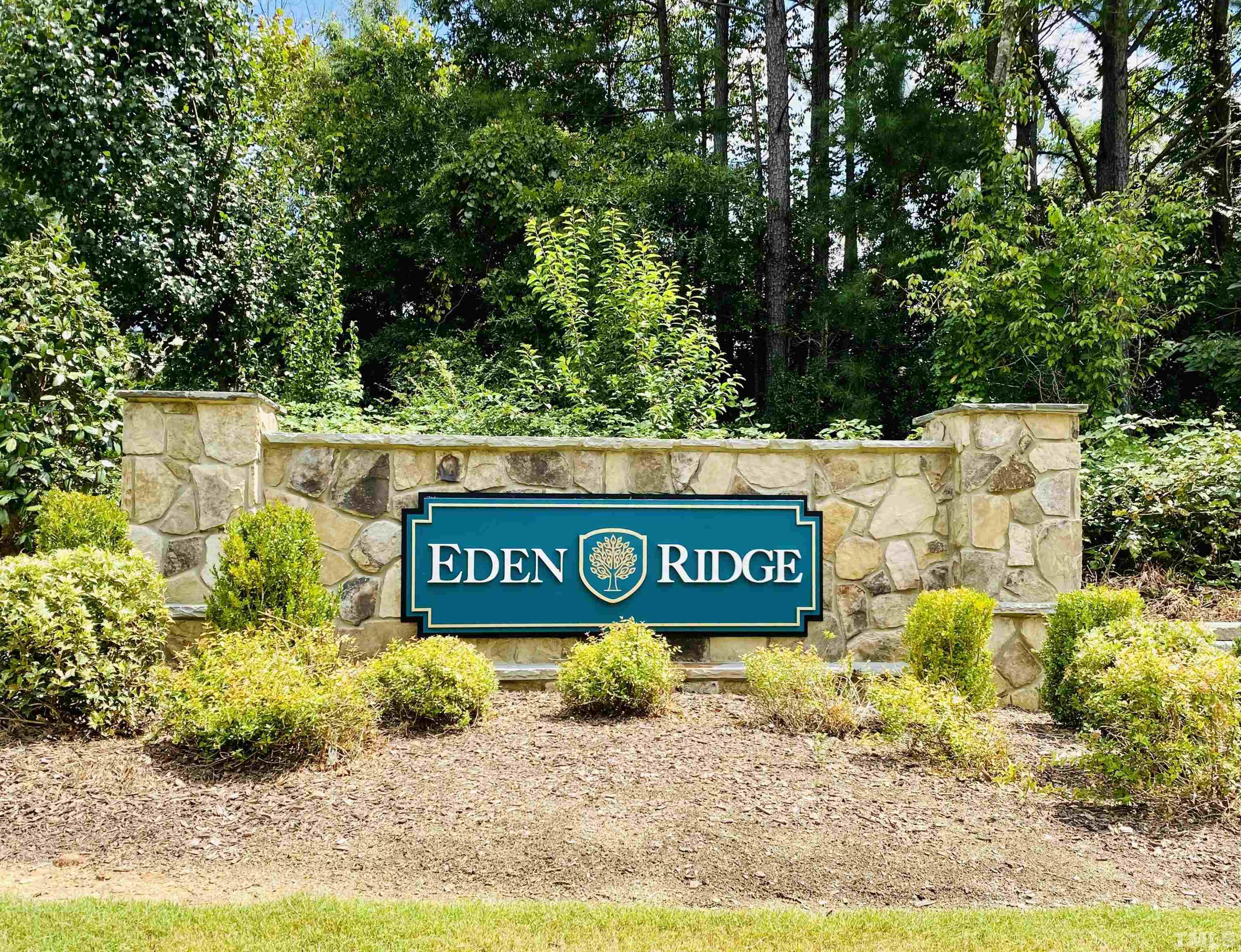 3028 Eden Harbor Court Raleigh, NC 27613 - Photo 23 of 32 a sign broad in front of flowers