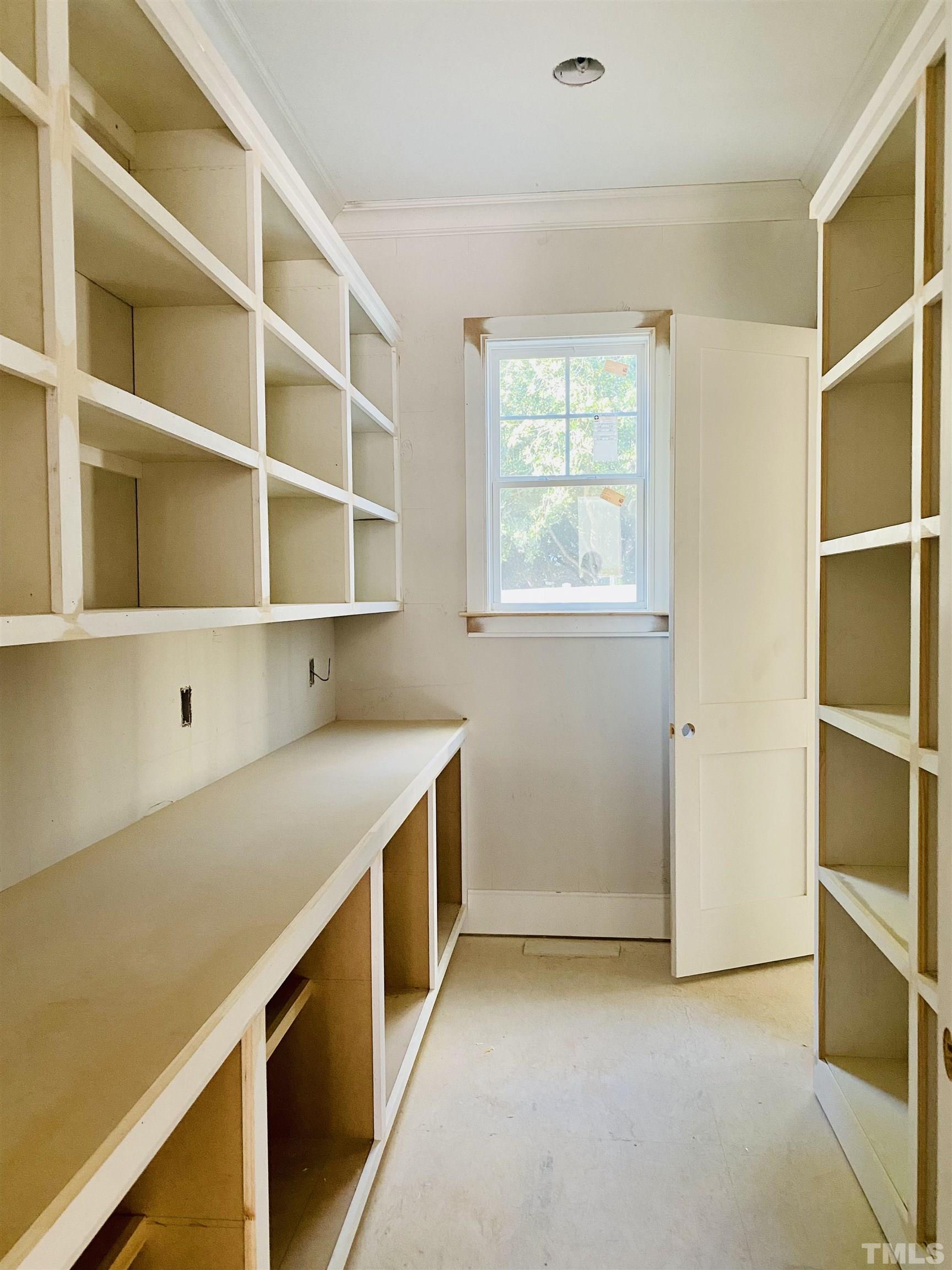 3028 Eden Harbor Court Raleigh, NC 27613 - Photo 28 of 32 a view of storage area with empty racks